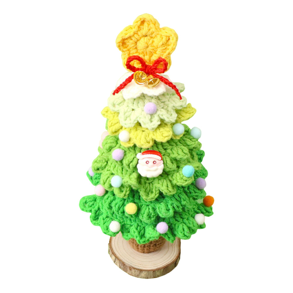 Light green crochet Christmas tree with pom-pom baubles and Santa charm on white
