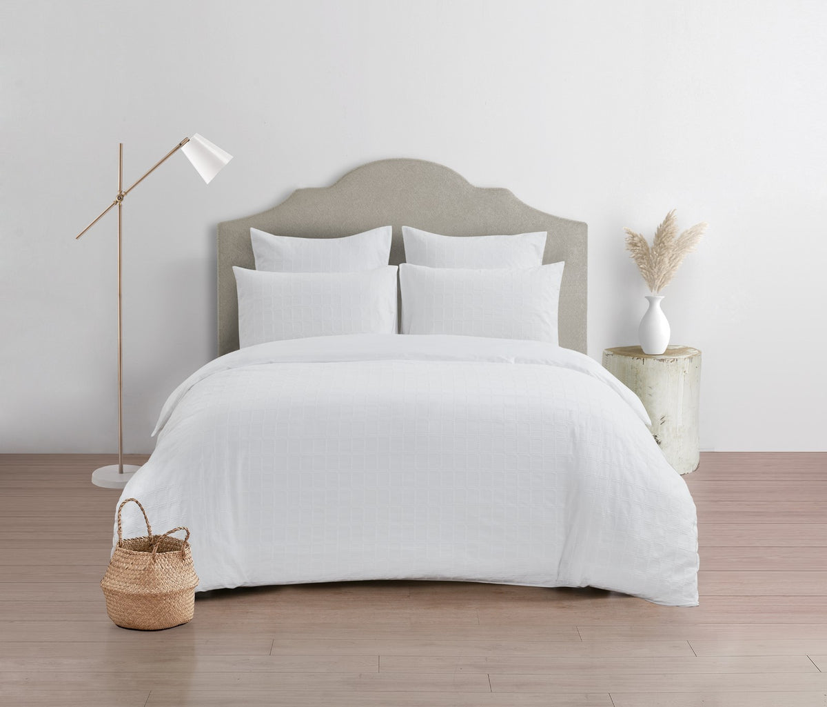 White jacquard quilt cover set in a light bedroom