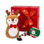 Christmas dog toy set with plush reindeer, rope tug and Santa ball beside gift box