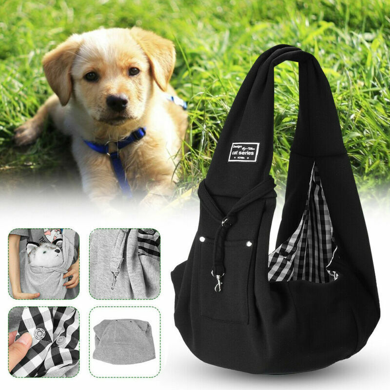Small dog carried in a pet sling bag