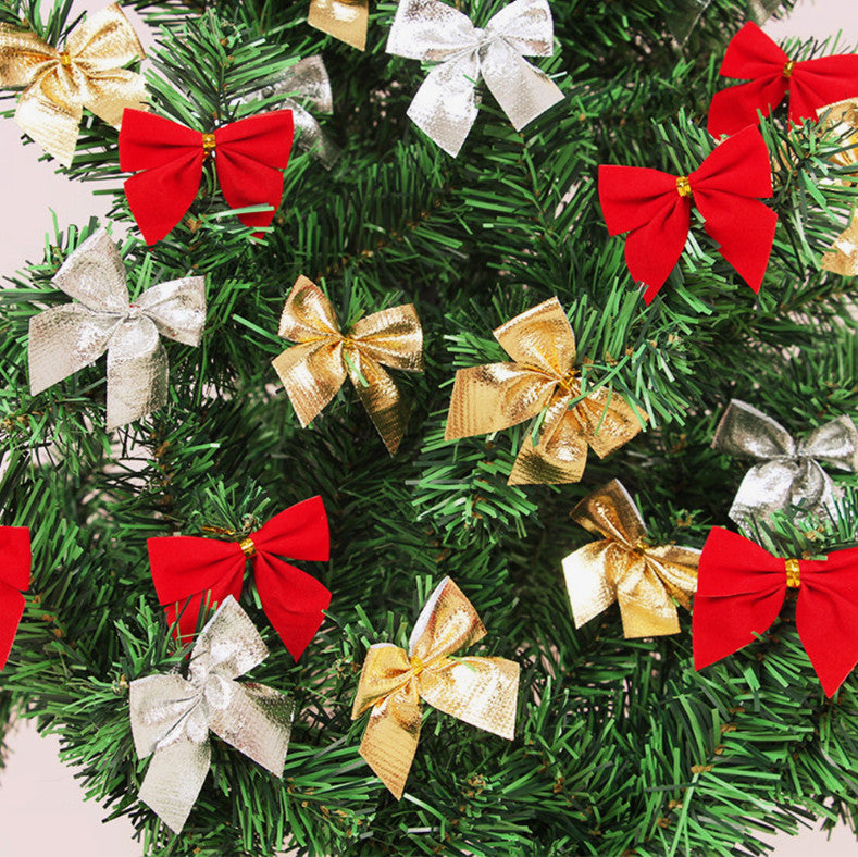 Red, gold and silver bows decorating a Christmas tree