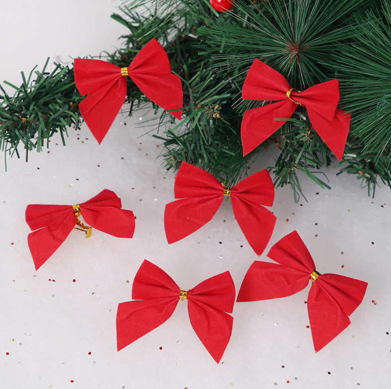 Red Christmas bows on a tree branch