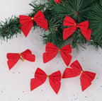 Red Christmas bows on a tree branch