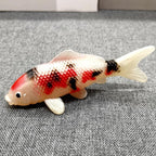Red and white koi model close-up