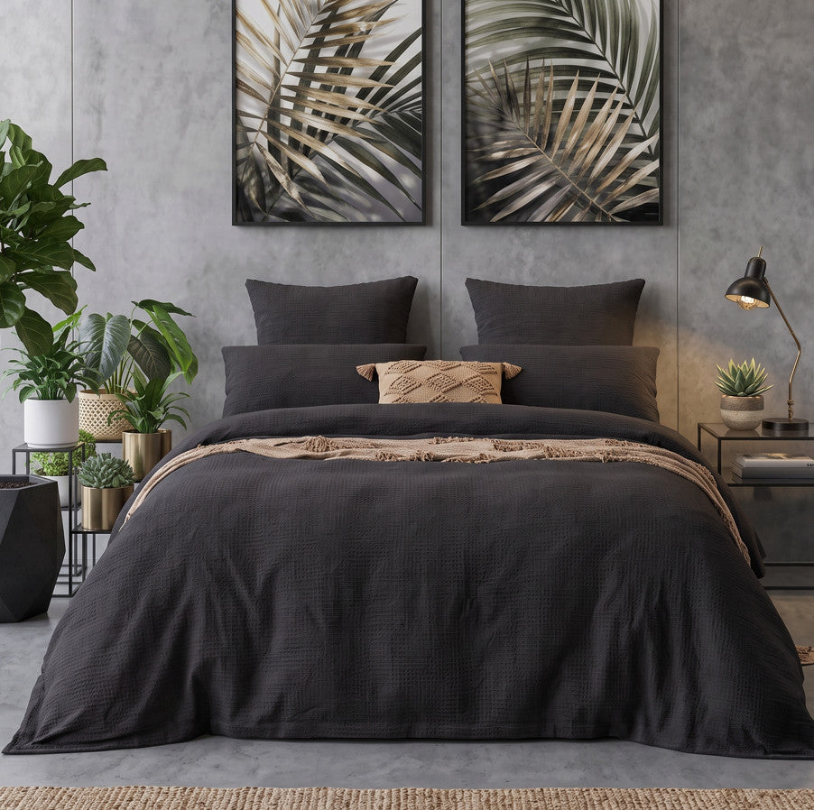 Black jacquard quilt cover set with tan throw
