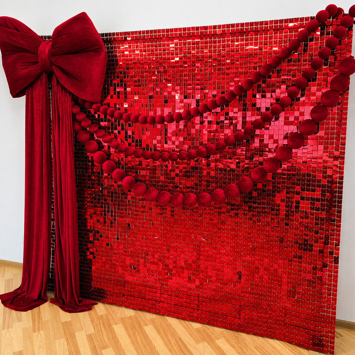 Red ball garlands with a sequin backdrop