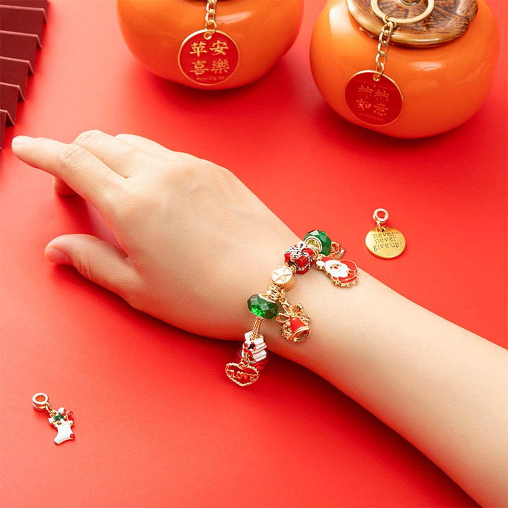 Christmas charm bracelet worn on a wrist