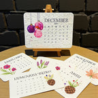 2027 plantable desk calendar monthly cards fanned out on a wooden table