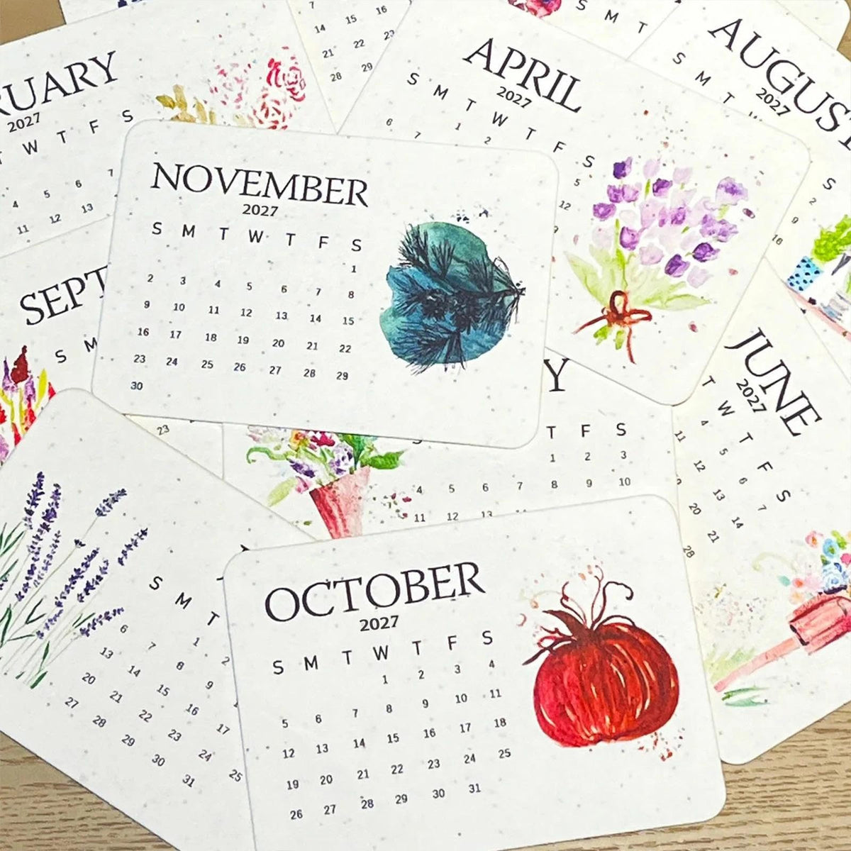 Plantable 2027 calendar monthly cards with watercolour fruit and flower motifs