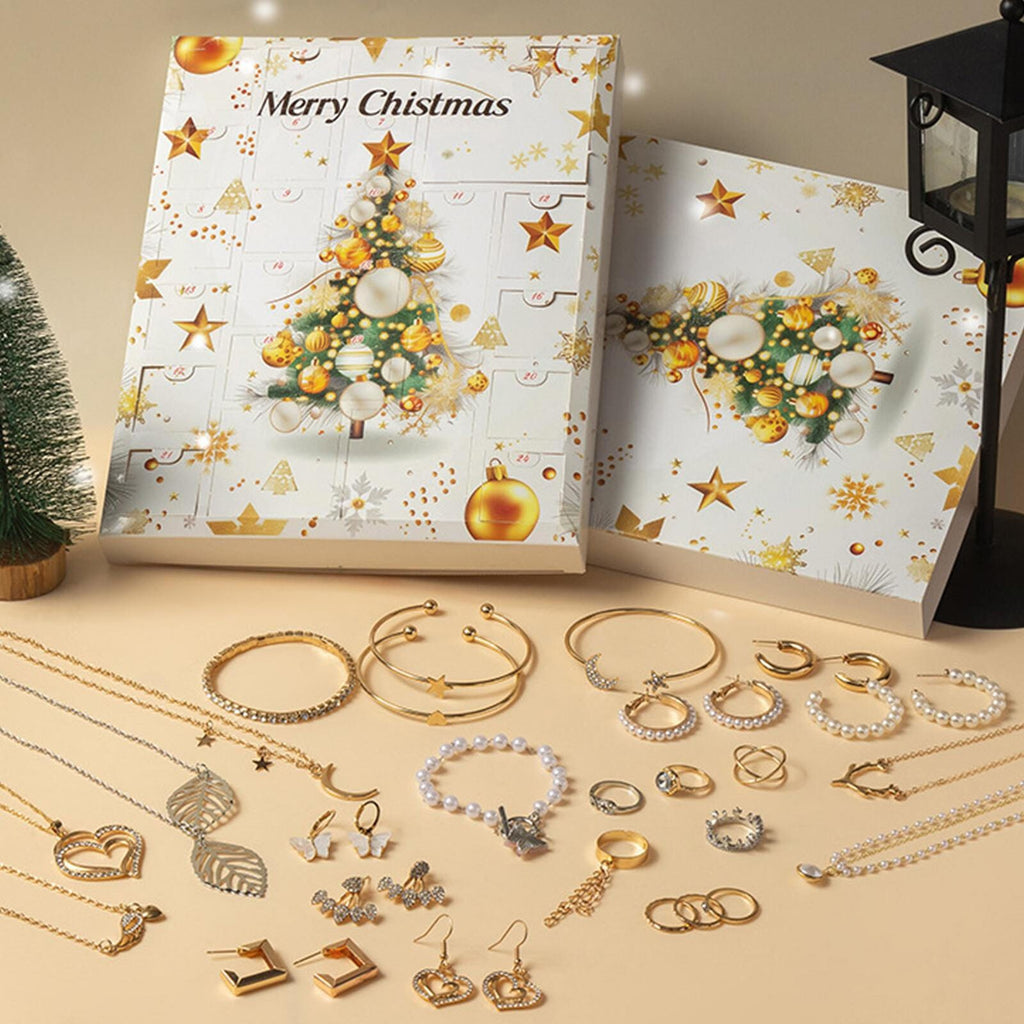 Gold Christmas tree jewellery advent calendar with necklaces and bangles laid out