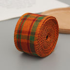 Orange, green and red plaid wired ribbon roll partly unrolled