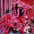 Pink ball garlands at a wedding backdrop