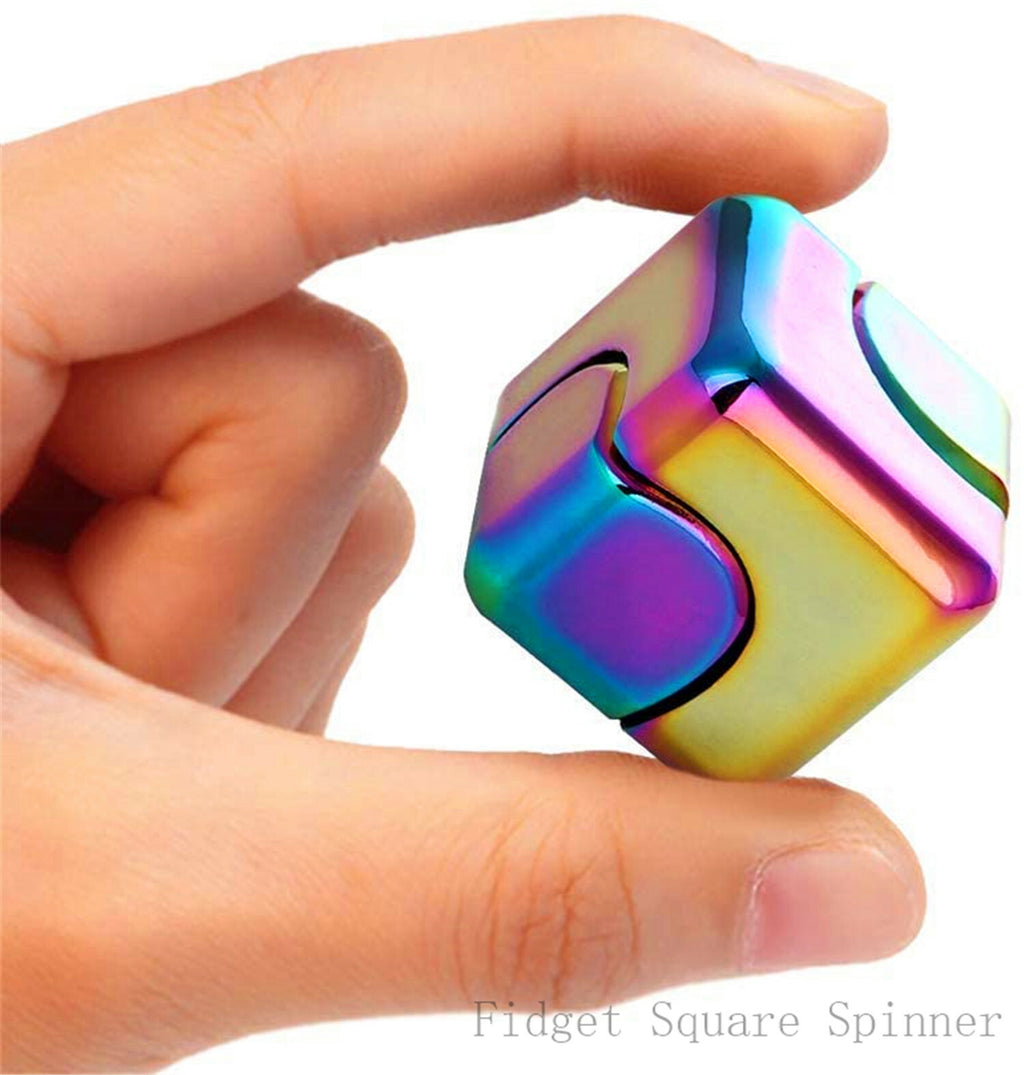 Holding the rainbow fidget cube