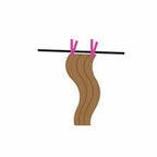 Pink costume wig on a wig stand