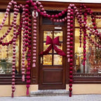 Red ball garlands around a shop door