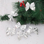 Silver Christmas bows on pine branches