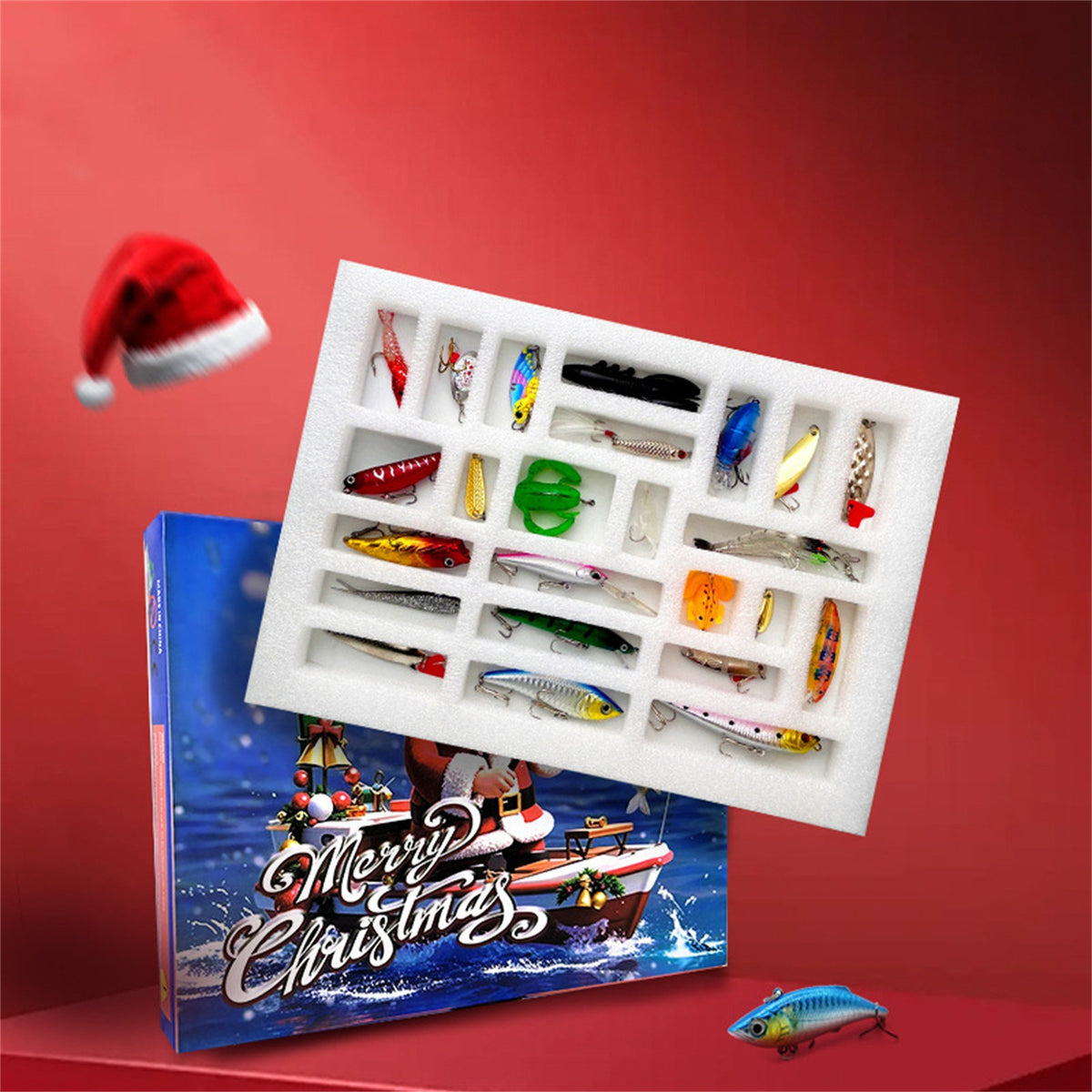 Open fishing advent calendar tray full of lures on a red Christmas background