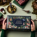 Hands holding the woodland stationery advent calendar box