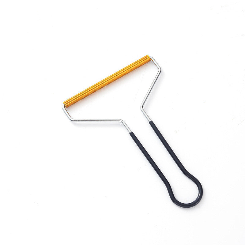 Black manual fabric shaver with gold-tone blade bar
