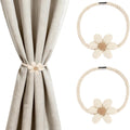 Curtain held back with magnetic flower tieback