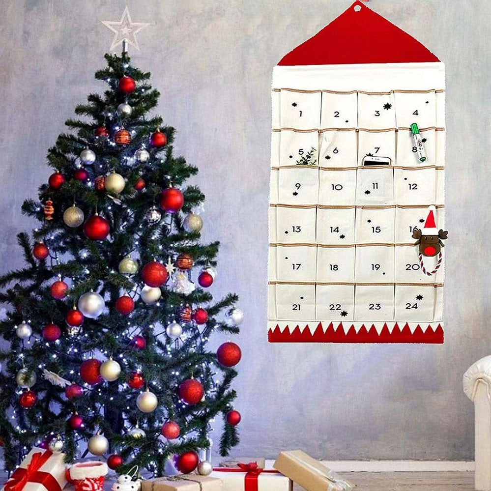 Red roof reusable fabric advent calendar beside a Christmas tree