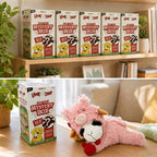 Lamb dog toy mystery boxes on a shelf and a pink plush lamb on a cushion