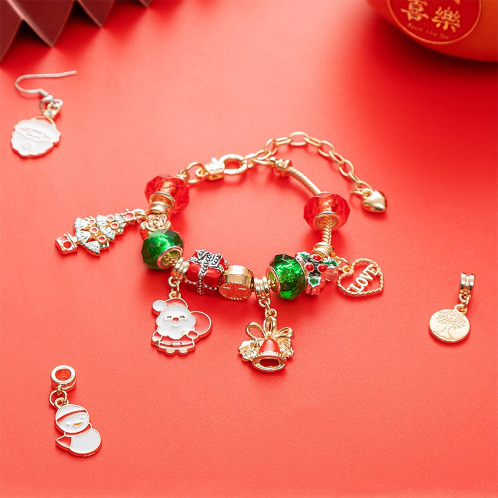 Charm bracelet with Santa, tree and bell charms
