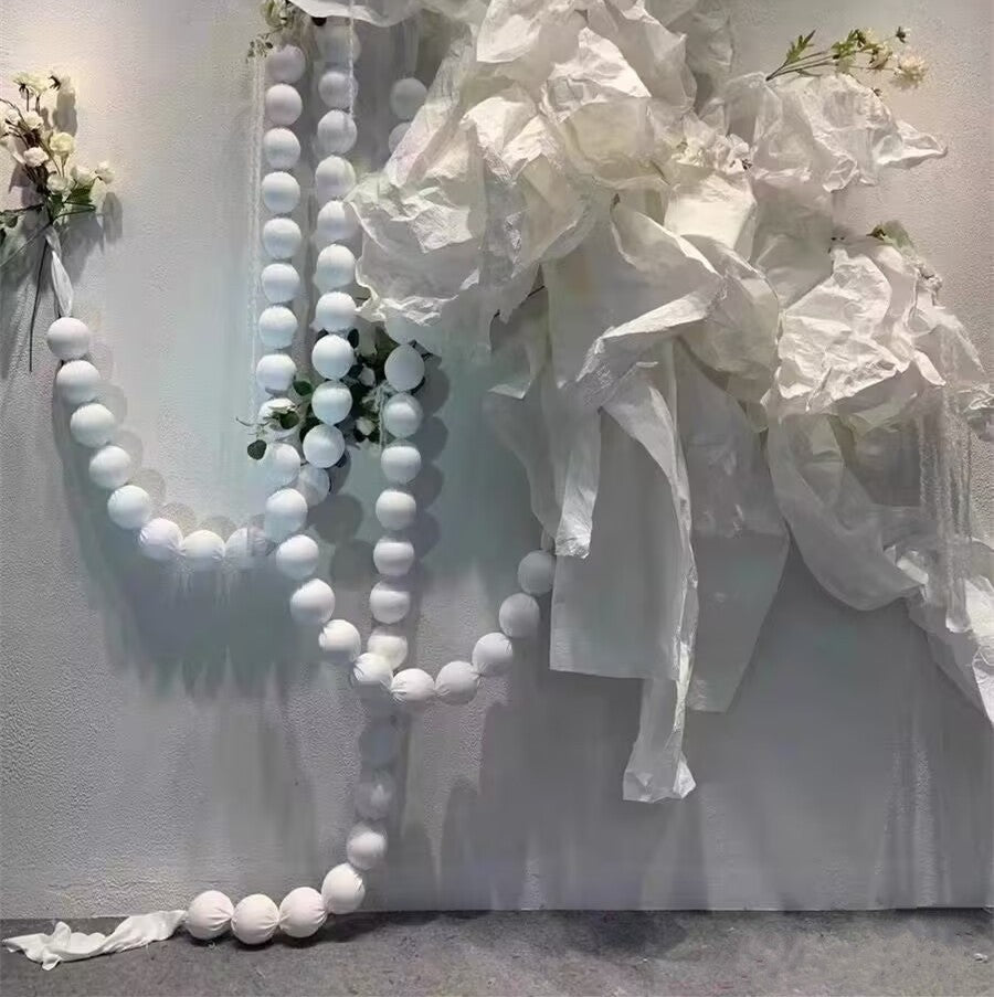 White ball garland on a wall