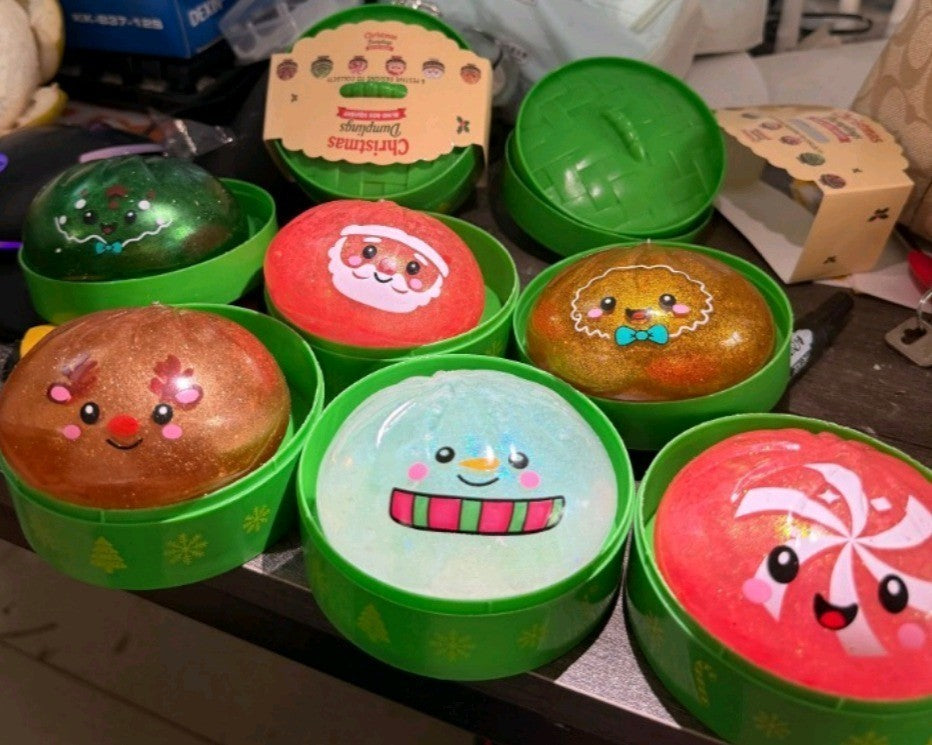 Real photo of six Christmas squishies in their bases