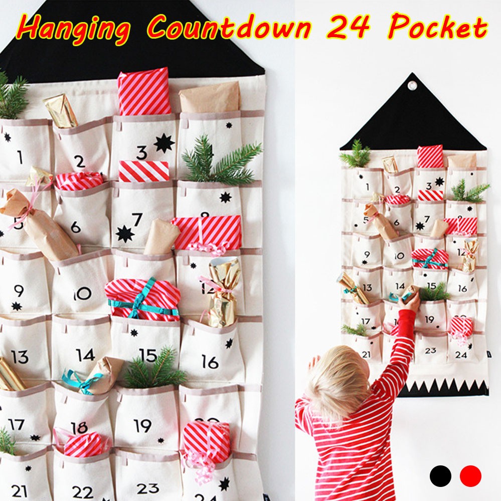 Child filling the hanging 24 pocket fabric advent calendar