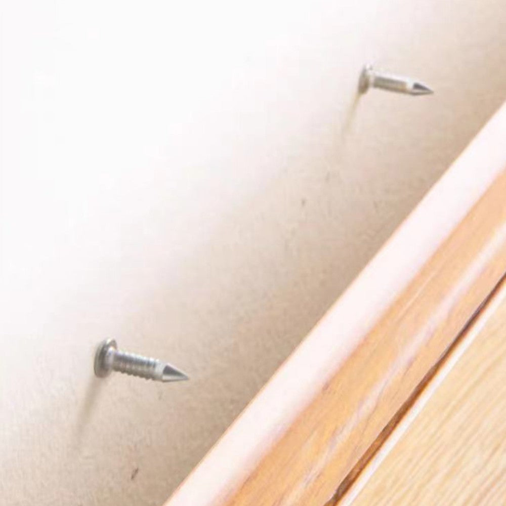 Nails in the wall ready for a skirting board