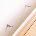Nails in the wall ready for a skirting board