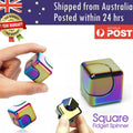 Square fidget spinner cubes held in hand