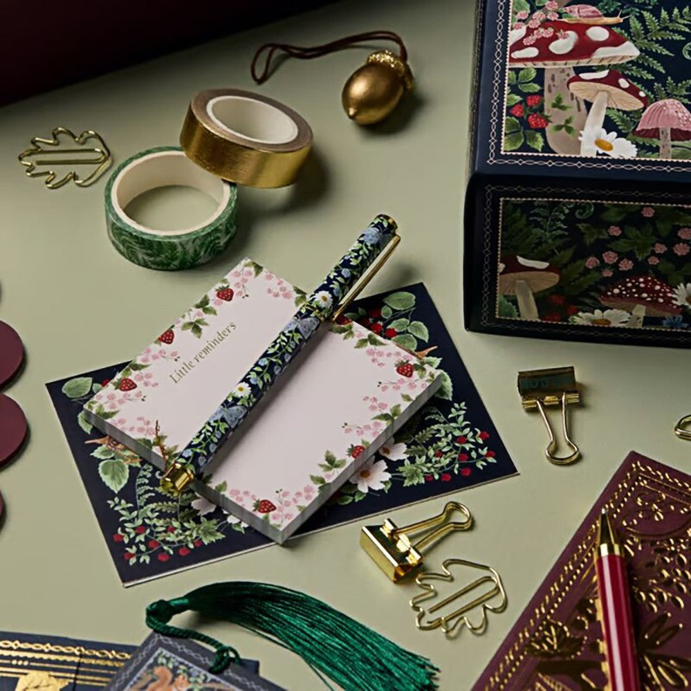 Notepad, pen, washi tape and gold paper clips from the stationery advent calendar