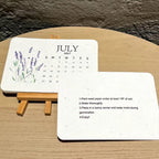 Back of seed paper calendar card showing planting instructions beside July card