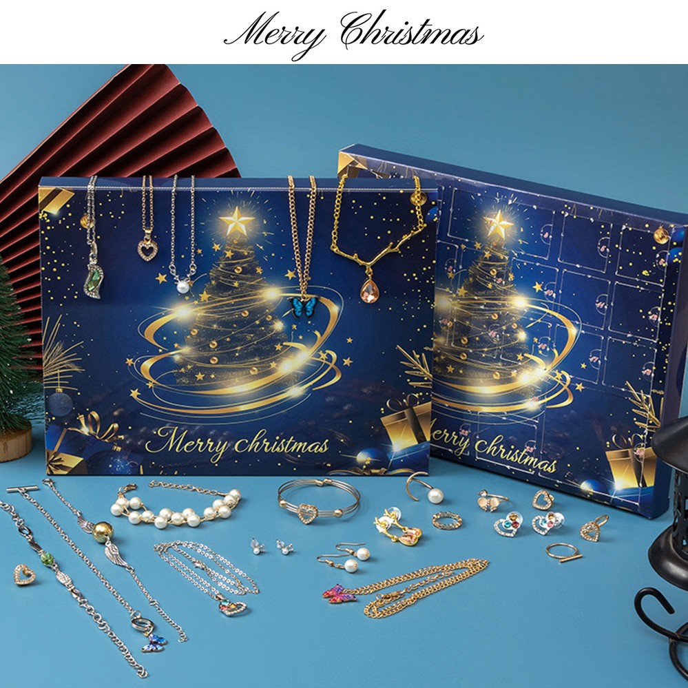 Blue Christmas tree jewellery advent calendar with pieces laid out